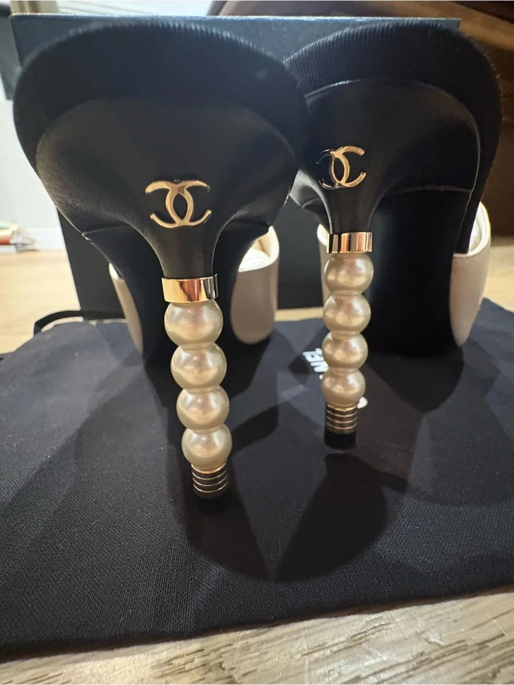 CHANEL Two-Tone Leather Mules with Pearl-Embellished Heel in White & Black